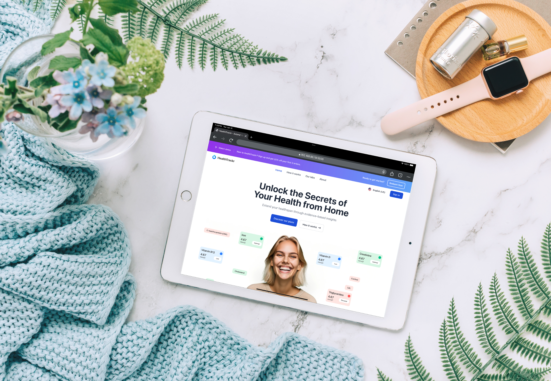 Healthtrackr marketing site shown on an iPad in a lifestyle setting