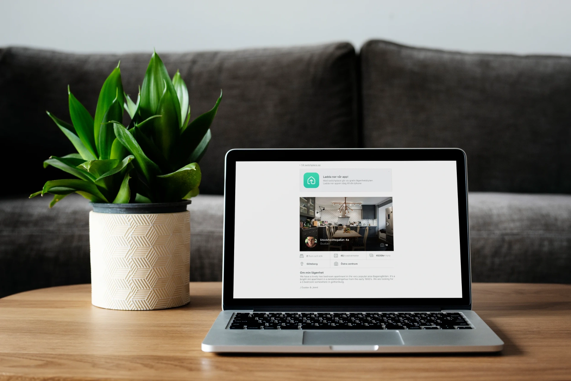 Switchplace web listing page shown on a MacBook with an app-download banner